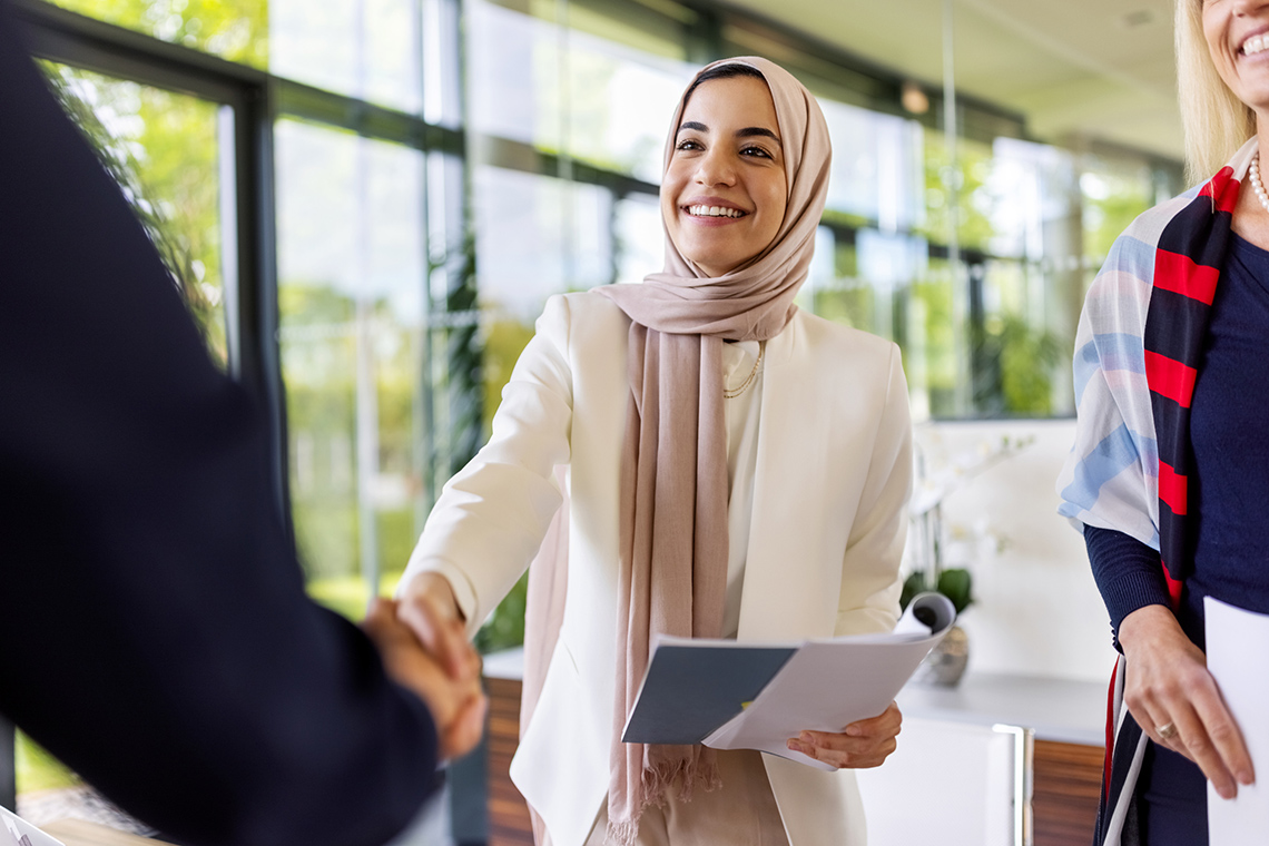 Business person sealing a deal with a handshake