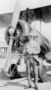 Wallace Turnbull standing in front of his invention, the variable pitch propeller
