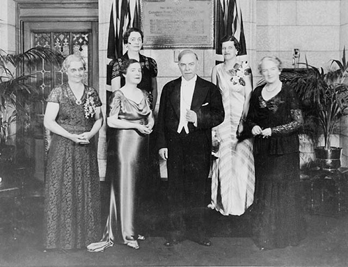 (Front row, L-R): Mrs. Muir Edwards, daughter-in-law of Henrietta Muir Edwards; Mrs. J.C. Kenwood, daughter of Judge Emily Murphy; Rt. Hon. Mackenzie King; Mrs. Nellie McClung. (Rear row, L-R): Senators Iva Campbell Fallis and Cairine Wilson