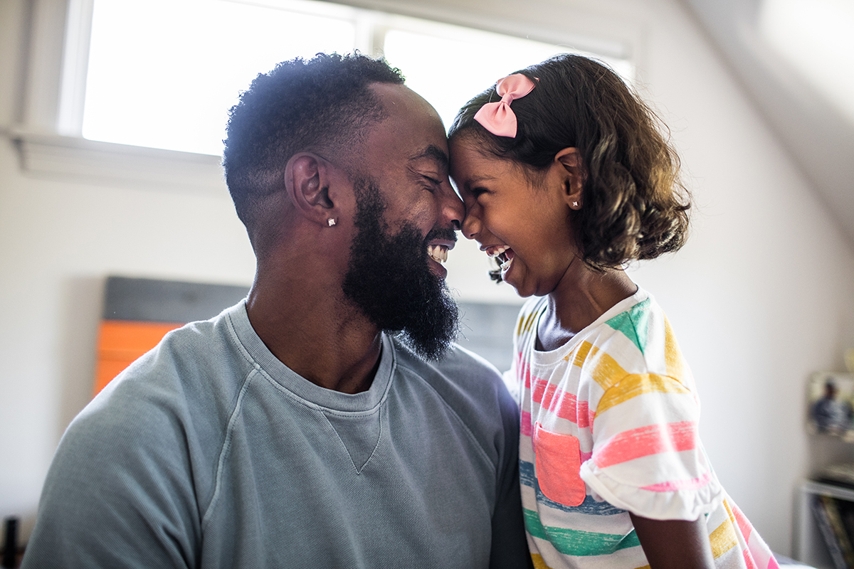 Parent laughing with a toddler