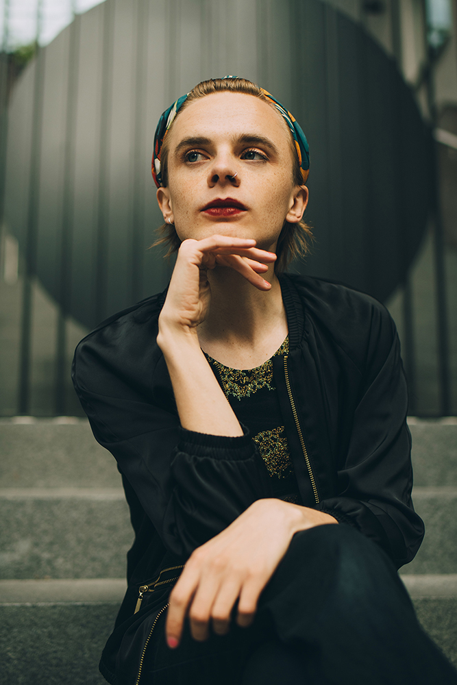 Young person thinking on a staircase