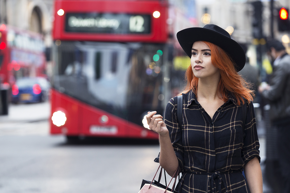 Young person walking on the street, appearing independent