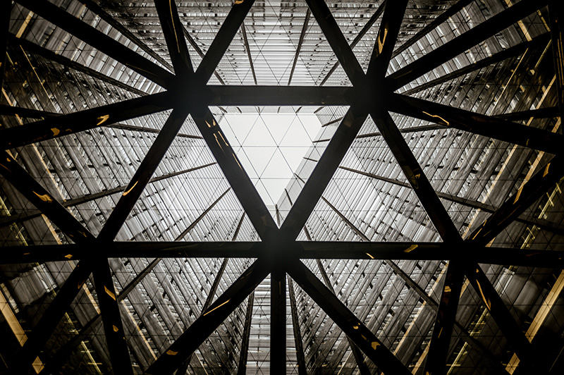 A series of connected triangles in architecture.