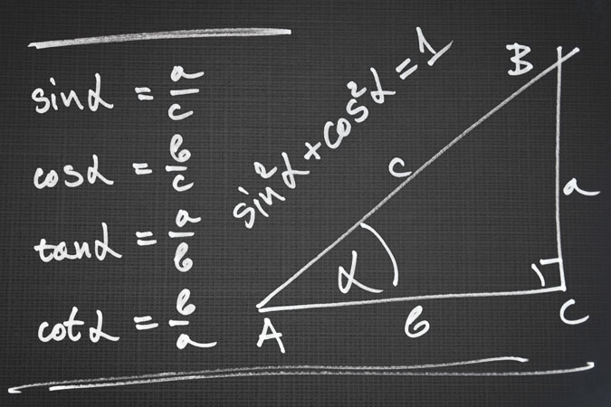 chalkboard with trigonometry doodles on it.