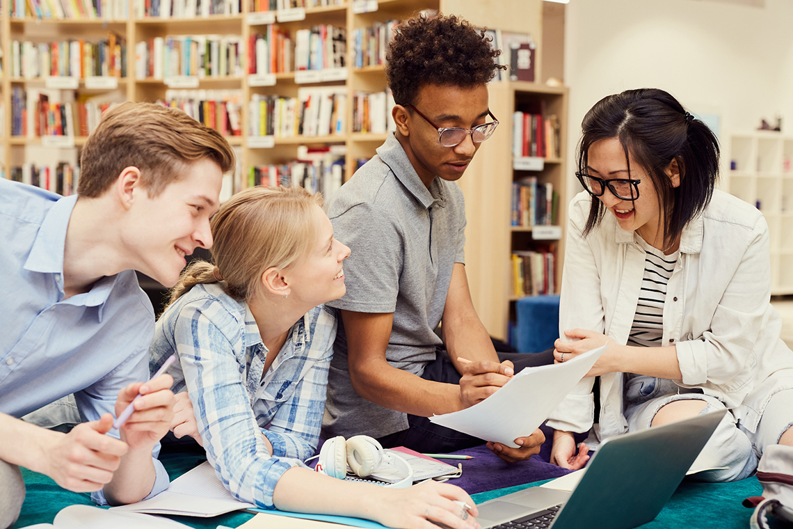 A group of students working together in a library