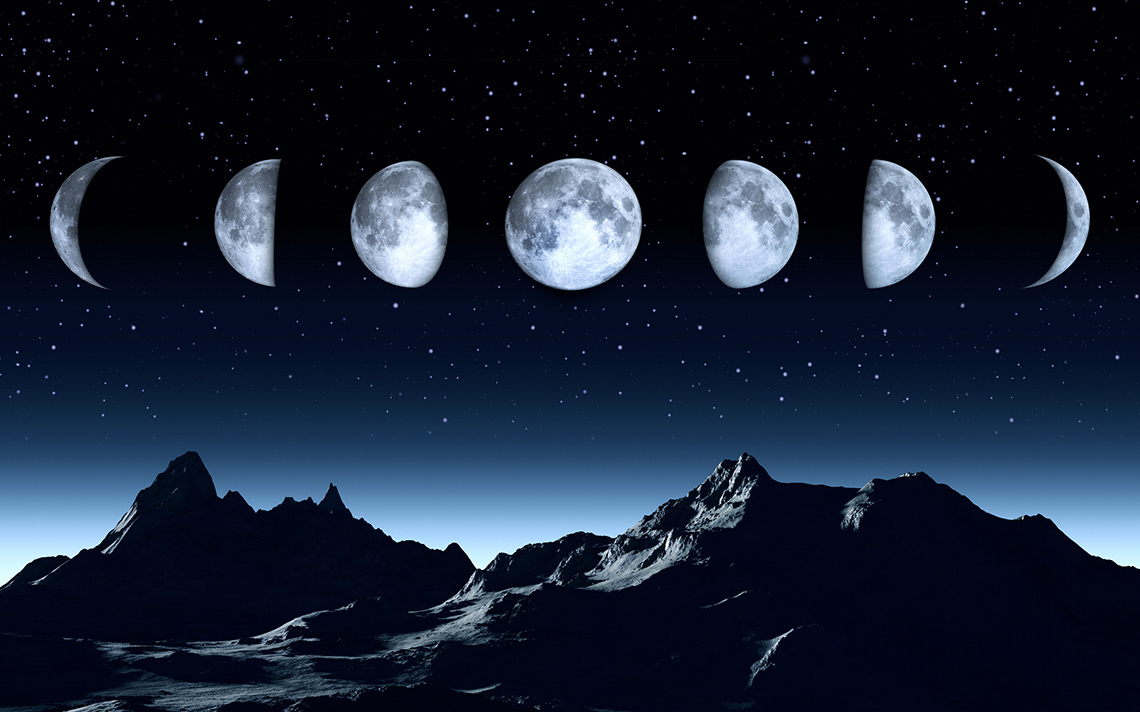 Phases of the moon in a night sky.