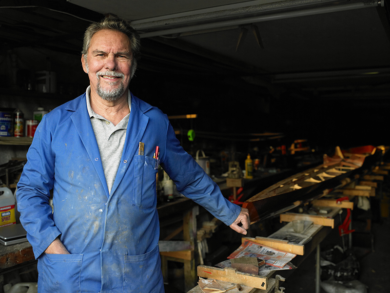Worker wearing blue coveralls